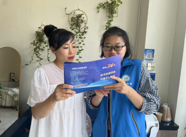 凯丰资本 济阳街道财工街社区开展反邪教宣传入商户活动